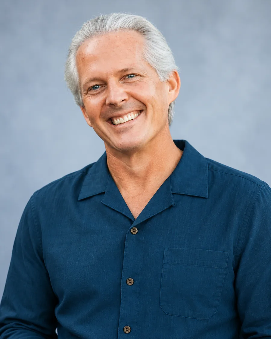 Portrait of Mark W. Pattison in a navy shirt, smiling